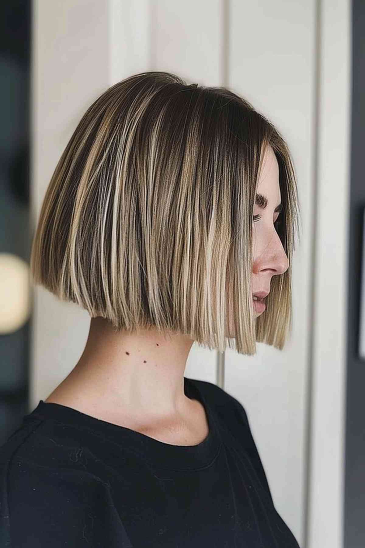 Woman with chin-length blunt bob and balayage highlights
