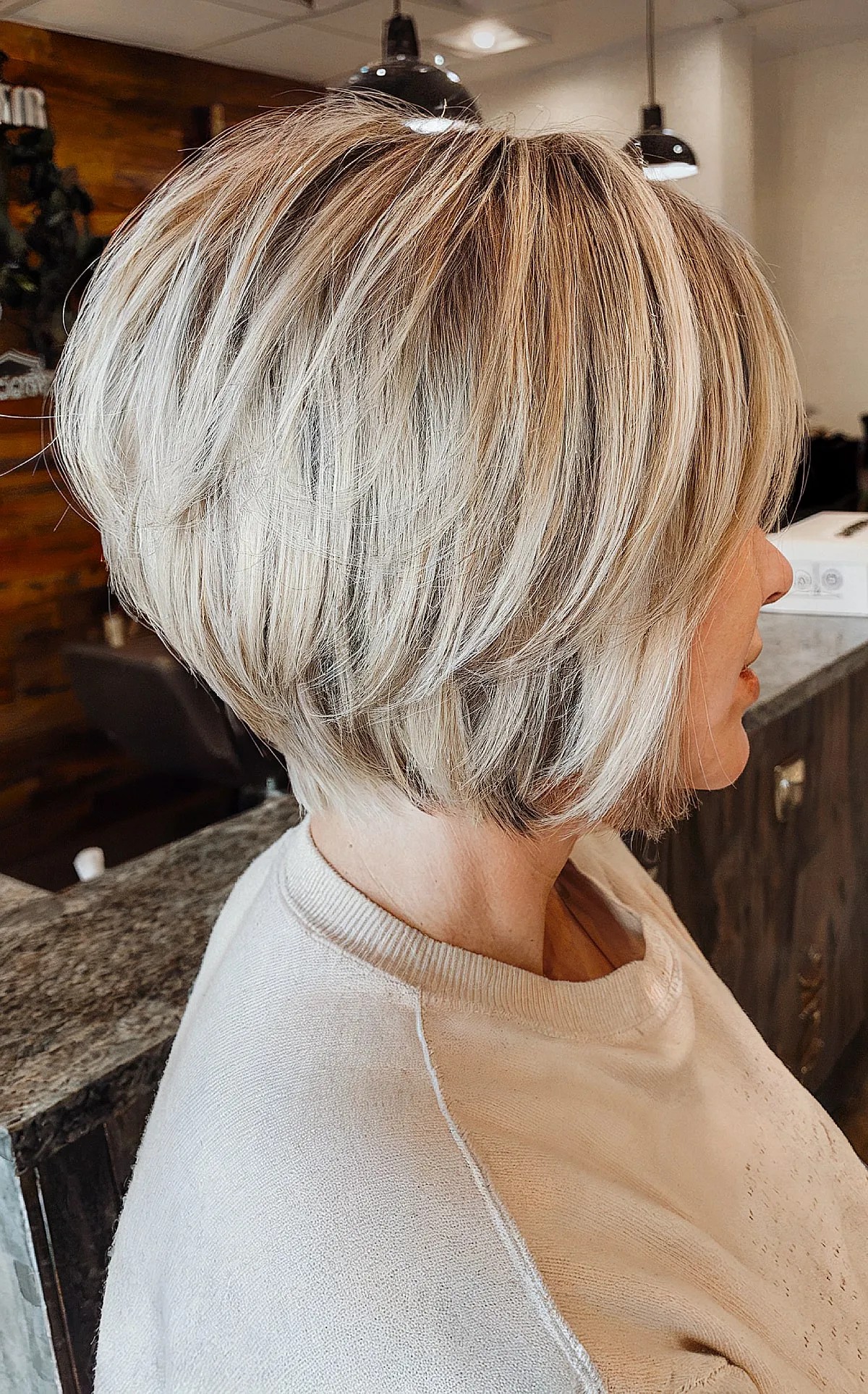 Earthy Blonde Tones on a Stacked Bob for women with short hair