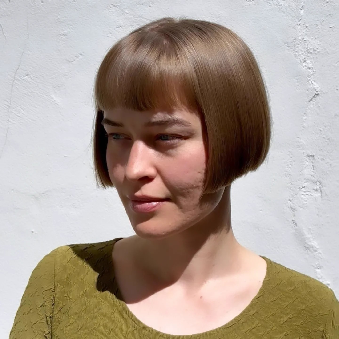 Polished Golden-Brown Bob with Precision Bangs